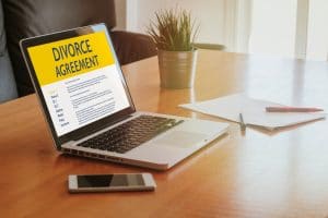Divorce Agreement concept: Laptop computer with Divorce Agreement